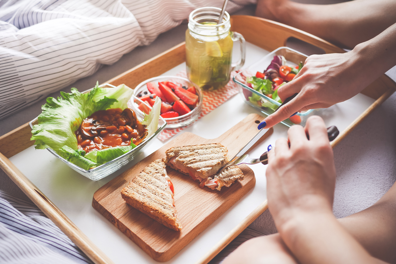 Young woman enjoying  breakfast